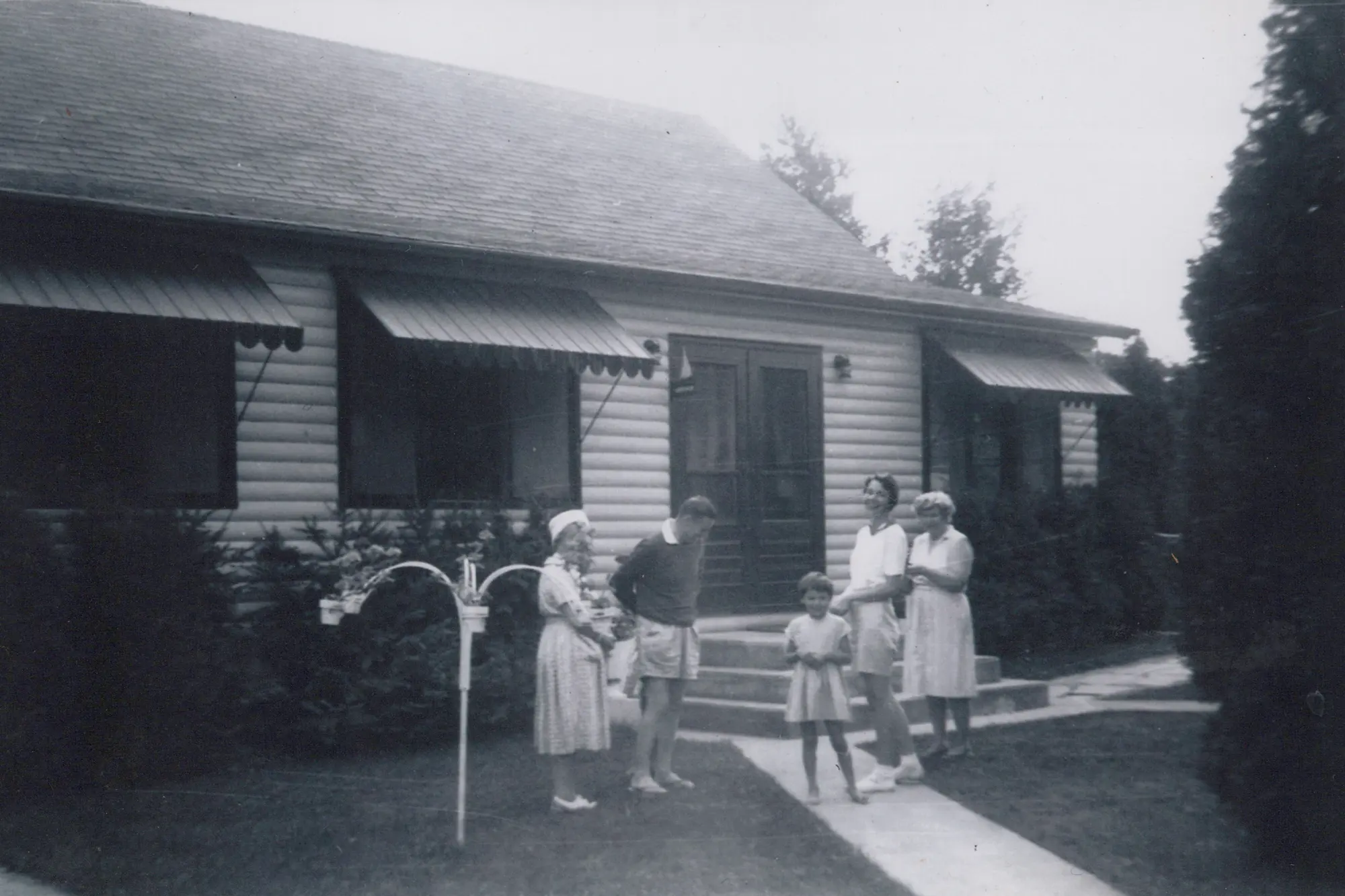 Guests walking to the dining room at Red Bay Lodge in the 1950s