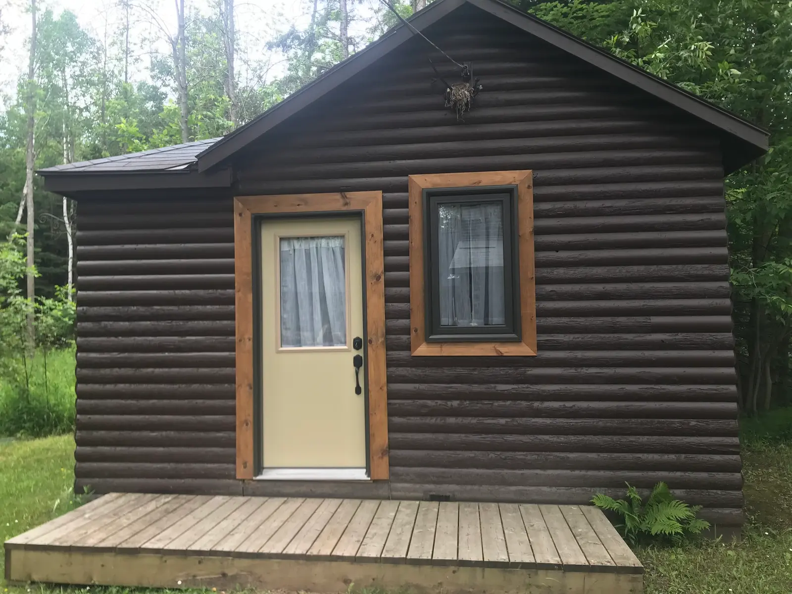 The Birch, a 1 bedroom wood cabin at Red Bay Lodge, with its own deck